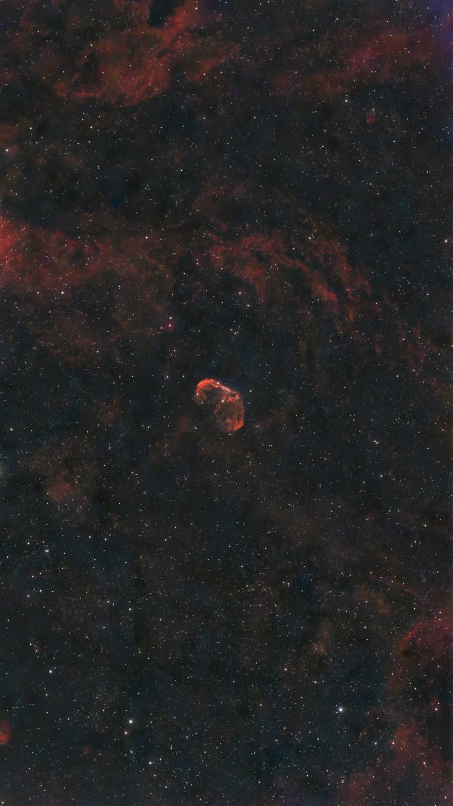 The glowing shell of the Crescent Nebula around the Wolf-Rayet star WR 136